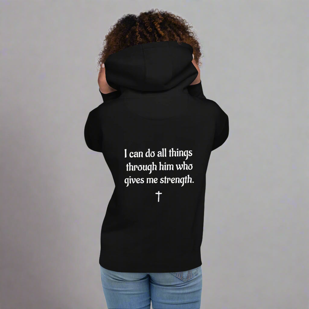 Unisex black hoodie with bible verse I can do all things through him who gives me strength with cross