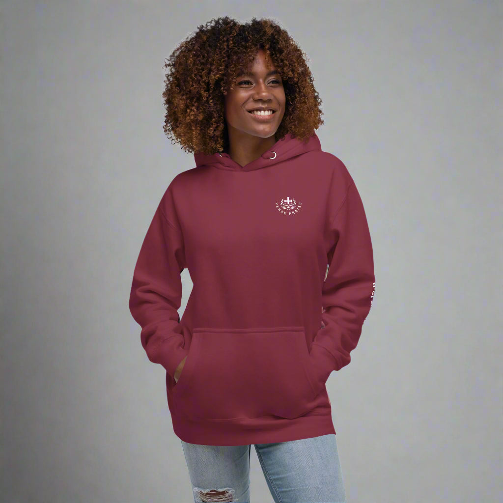 Unisex maroon hoodies with verse praise logo on the front, Romans 12:2 on left sleeve, Do not be conformed to this world but be transformed by the renewal of your mind with cross