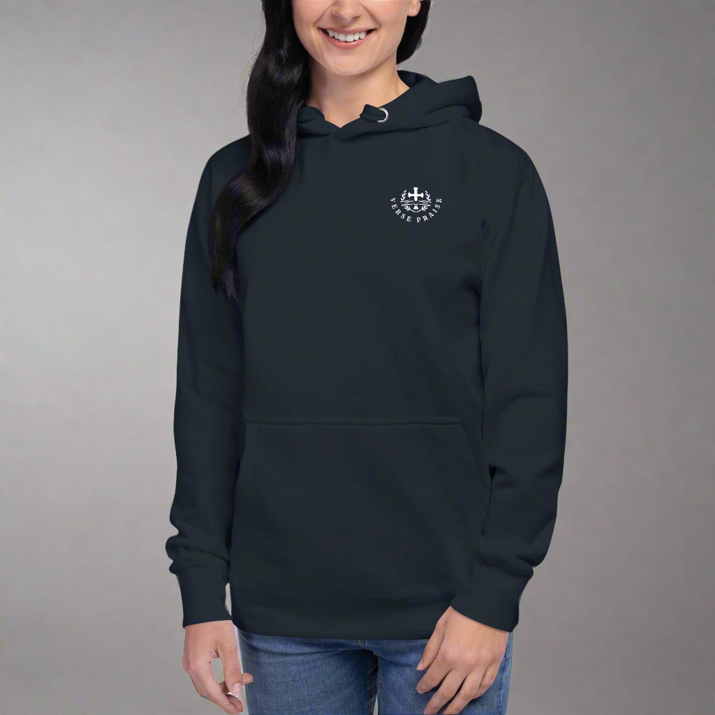 Unisex navy hoodie with verse praise logo on the front, Romans 8:28 on left sleeve, And we know that in all things God works for the good of those who love him verse with cross